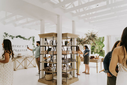 All white olive branch bridal shower with an epic grazing table