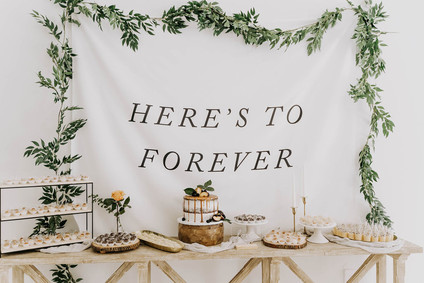 All white olive branch bridal shower with an epic grazing table