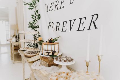 All white olive branch bridal shower with an epic grazing table