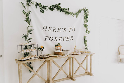 All white olive branch bridal shower with an epic grazing table