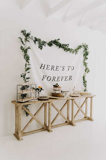 All white olive branch bridal shower with an epic grazing table