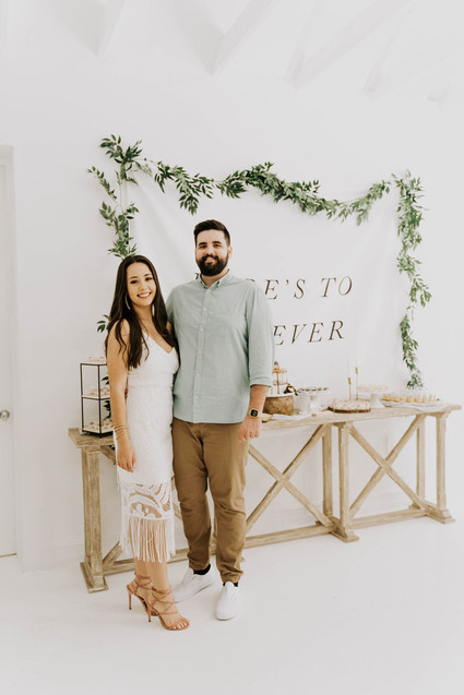 All white olive branch bridal shower with an epic grazing table