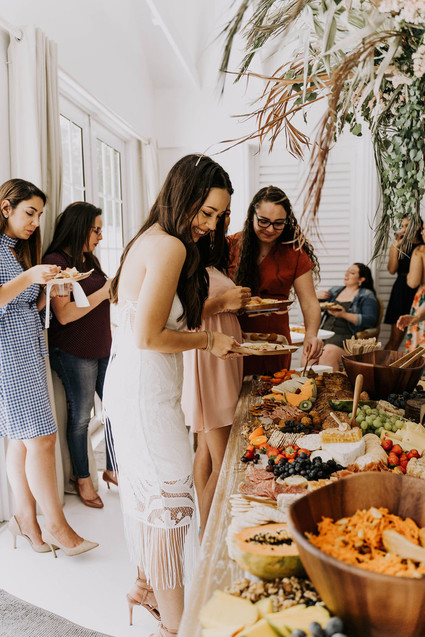 All white olive branch bridal shower with an epic grazing table