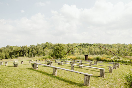Farm to table summer barn wedding with pops of red and a PARADE