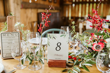 Farm to table summer barn wedding with pops of red and a PARADE
