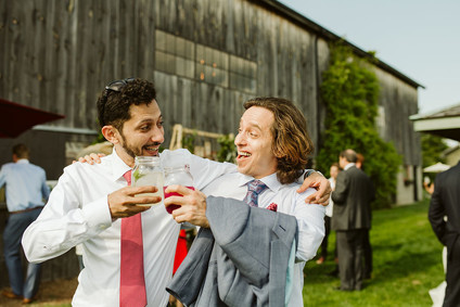 Farm to table summer barn wedding with pops of red and a PARADE