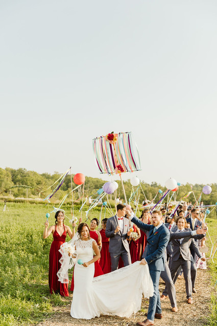 Farm to table summer barn wedding with pops of red and a PARADE