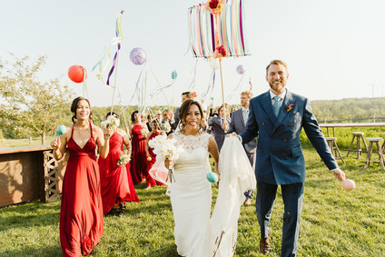 Farm to table summer barn wedding with pops of red and a PARADE