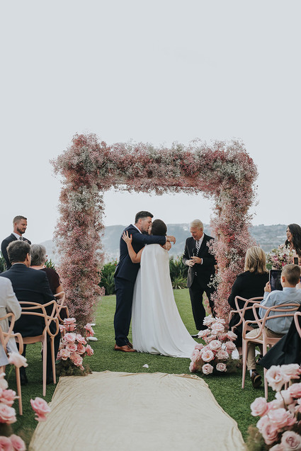 Pink babies breath wedding arch