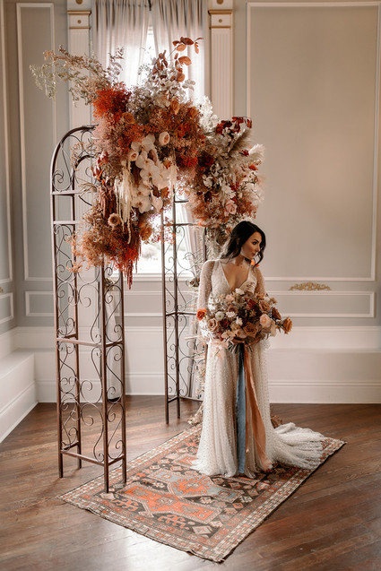 Lush fall floral ceremony arch