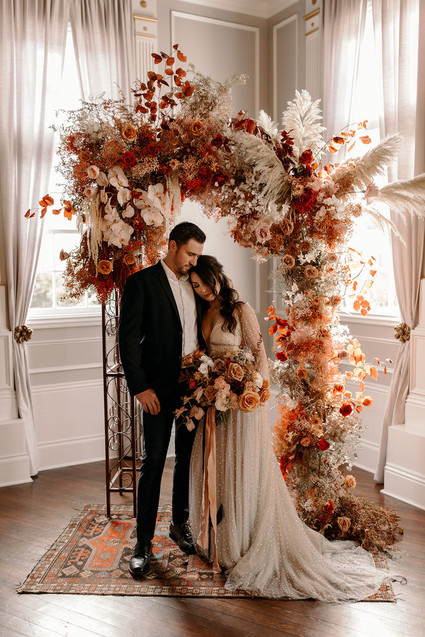 Lush fall floral ceremony arch