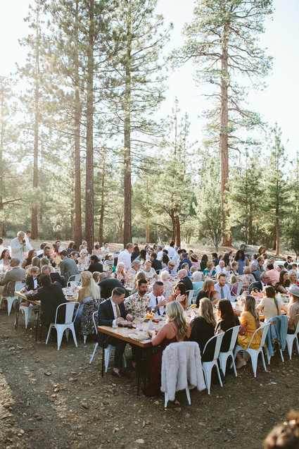 long reception table in forest wedding