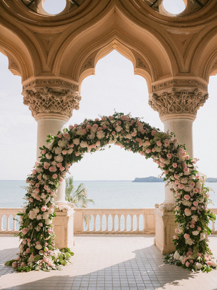 pink floral arch for ceremony