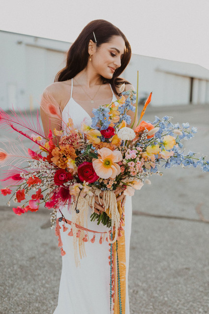 colorful bridal bouquet with feathers