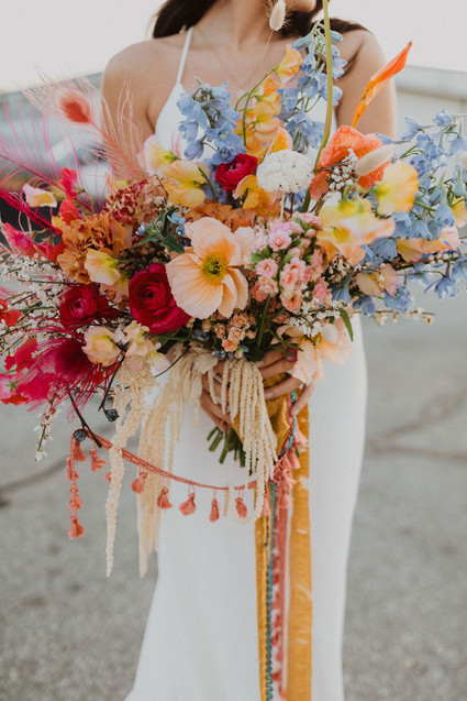 colorful bridal bouquet with feathers
