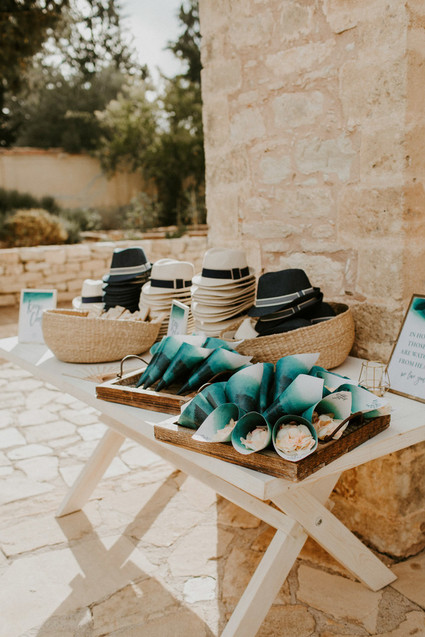 hat and fans for wedding ceremony