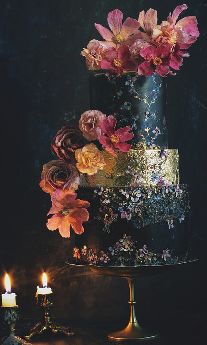 black wedding cake with flowers