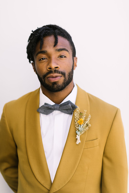 Mustard grooms suit