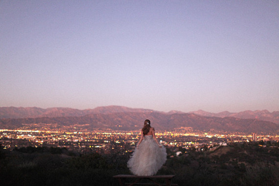 Bride looking over city skyline