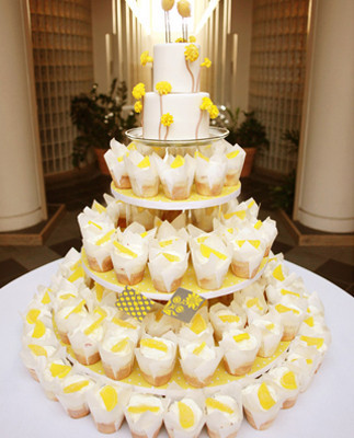 Yellow colored cupcake tower