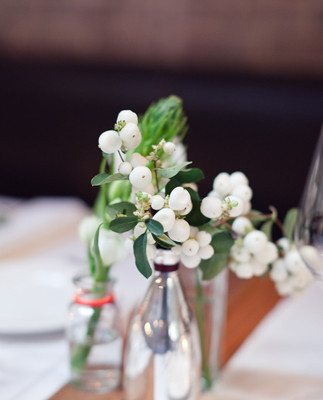 DIY floral centerpieces in glass bottles