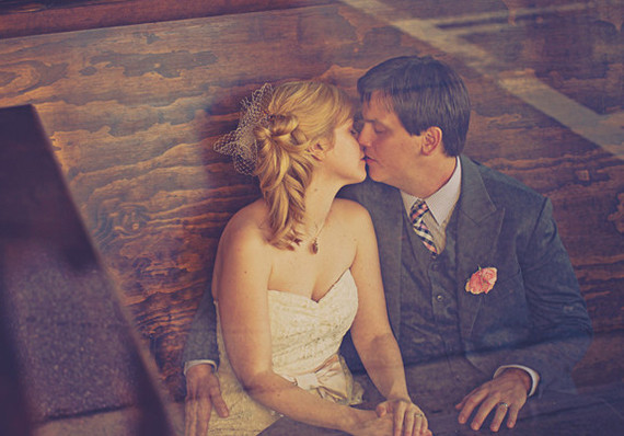 Rustic couple kissing portrait