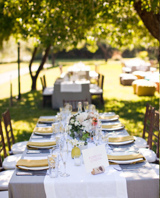 Sunny outdoor seating with yellow napkins