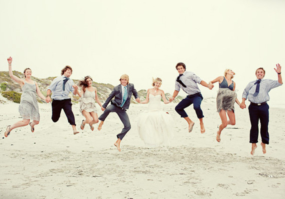 Jumping bridal party and friends portrait