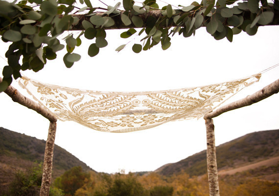 lace fabric and greenery chuppah