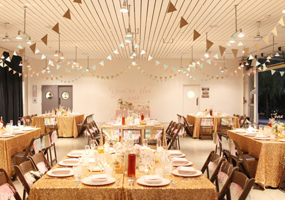 paper bunting garlands and sparkly gold linen