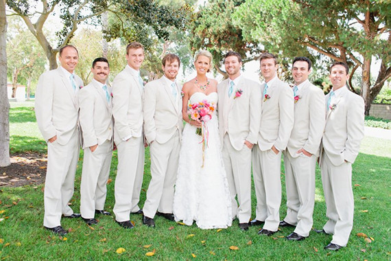 Bride with groomsmen in grey suits