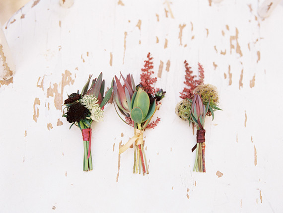 Deep colored boutonnieres Inspiration