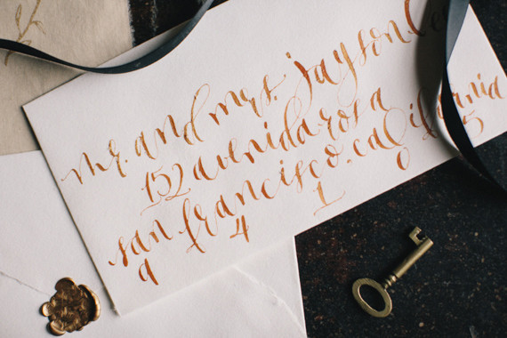 Orange calligraphy wedding envelope