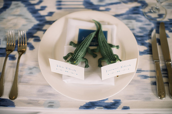 Blue and white place setting with crocodile escort card