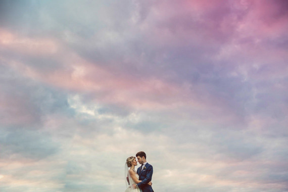 Rainbow sky wedding portrait