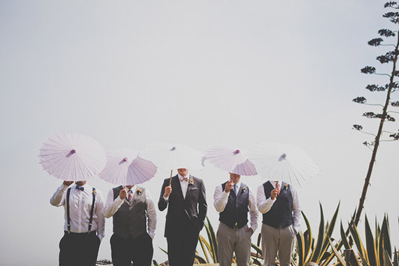 Groomsmen with pink umbrellas