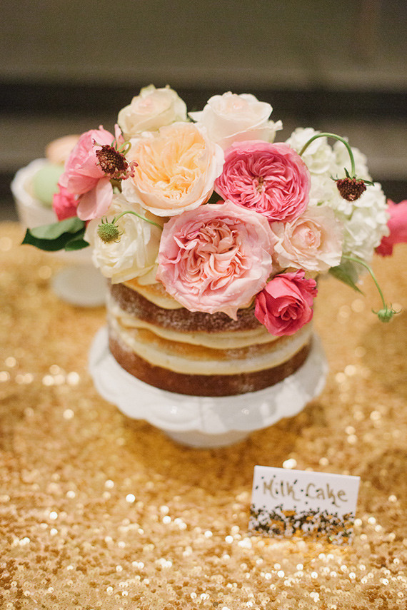 Naked cake with pink peony cake topper