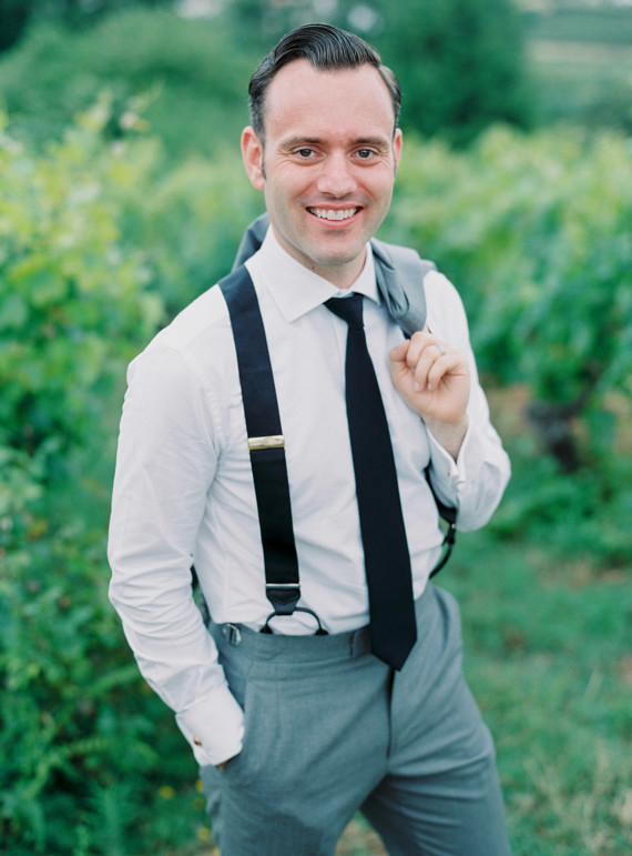 Groom with black suspenders