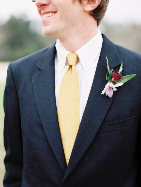 Groom boutonniere and yellow tie