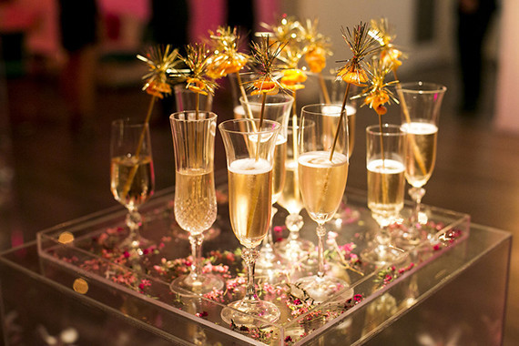 Champagne with gold cocktail stirrer