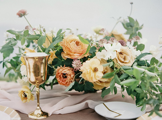 Orange ranunculus floral centerpiece