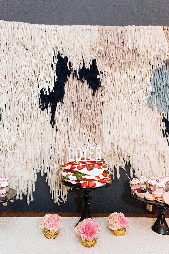 Dessert table with fringe backdrop