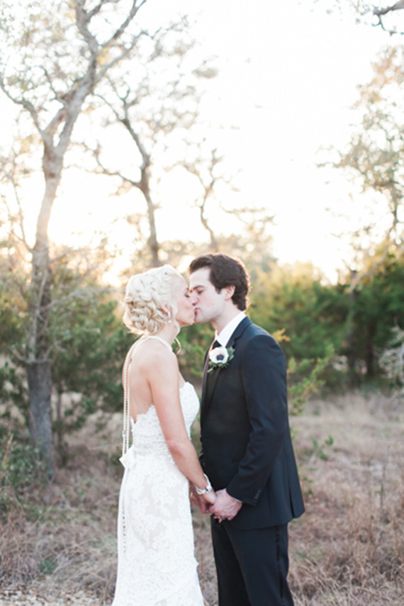 Kissing outdoor wedding portrait