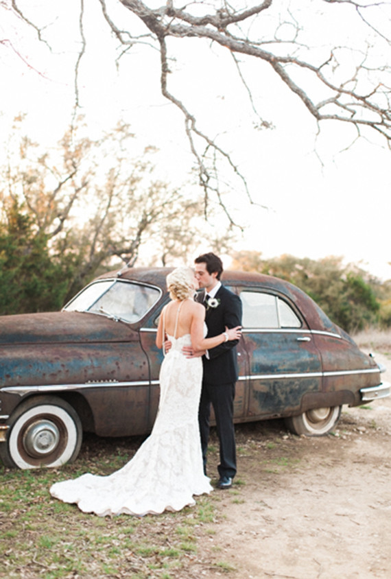 Kissing outdoor wedding portrait
