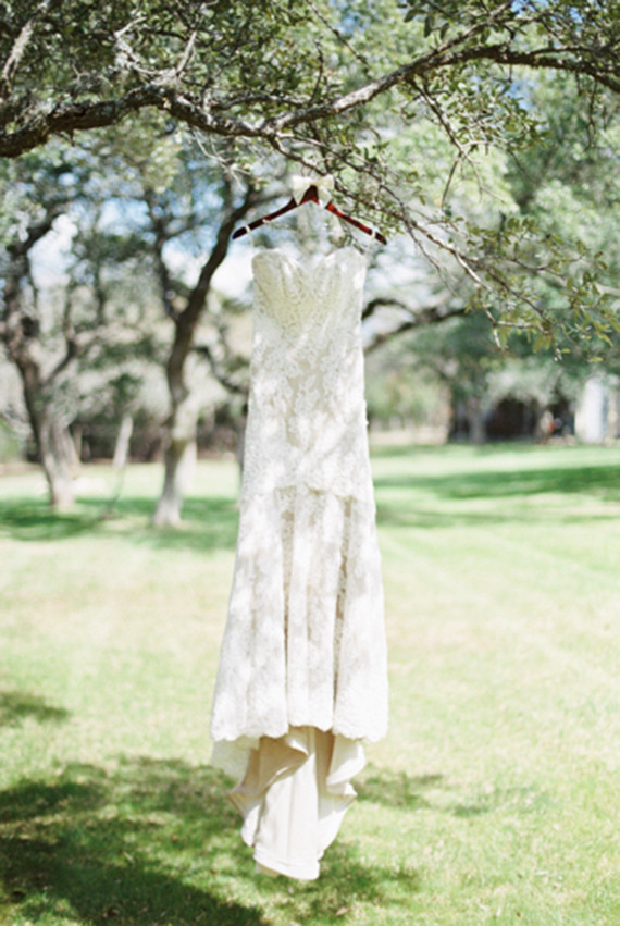 Wedding dress hanging from tree