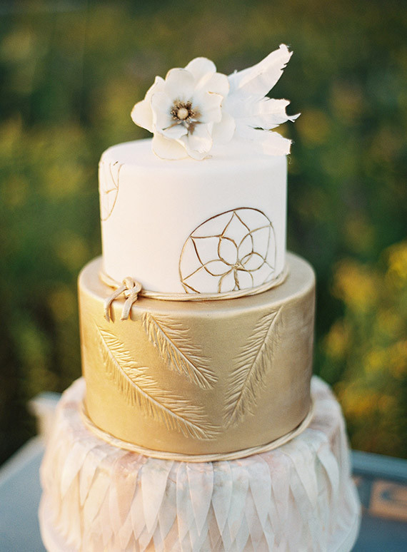 Gold and white cake with feathers
