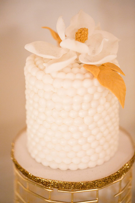 Gold cake with floral topper