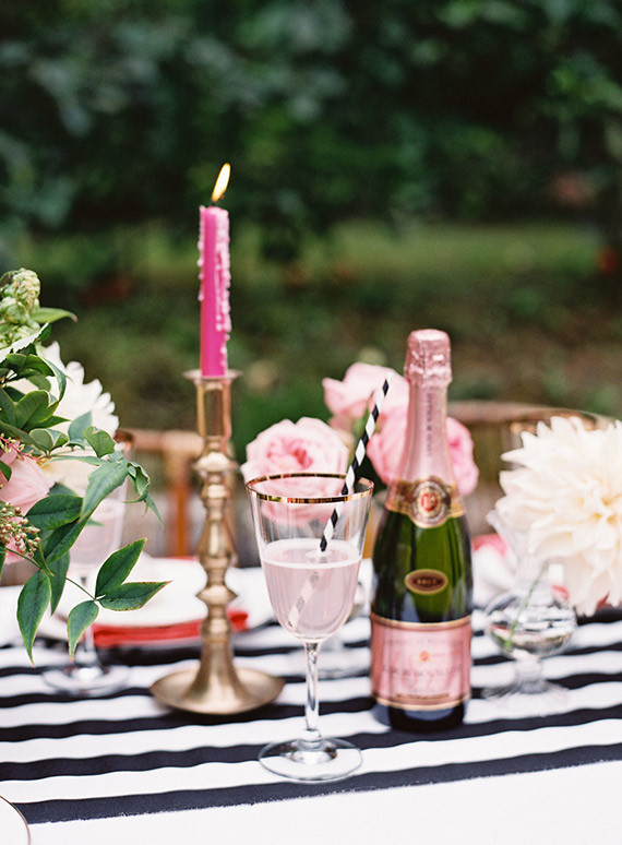 Gold candlestick with pink candle