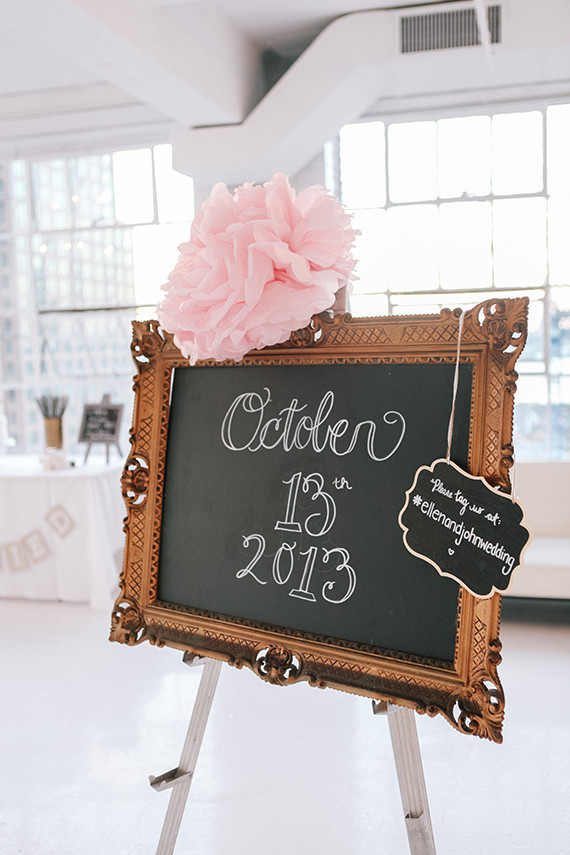 Gold chalkboard sign with giant pink flower