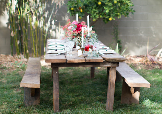 Backyard dinner party wooden tablescape